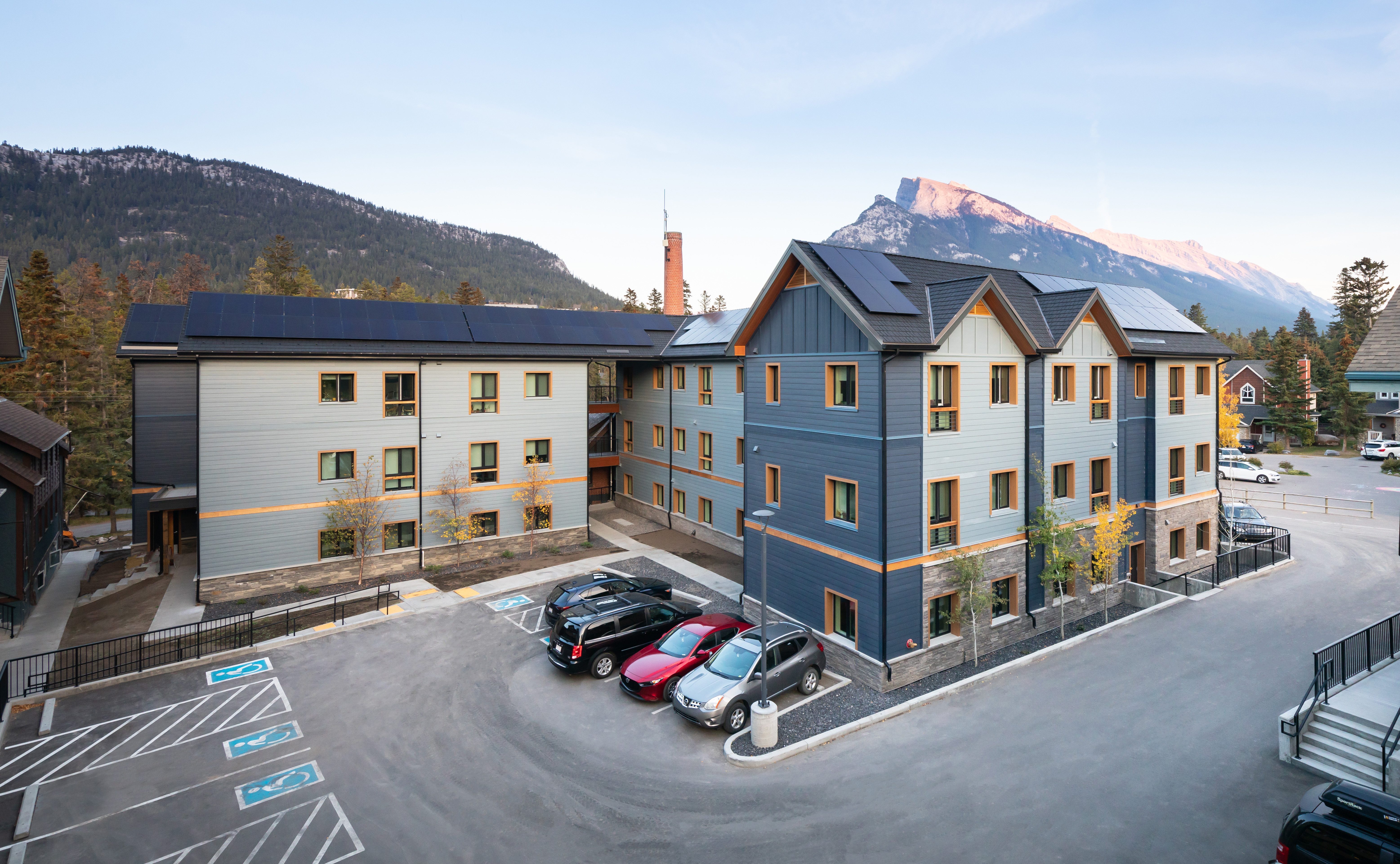 A wide angle photo of the Priscilla's Place affordable housing complex in Banff, Alberta