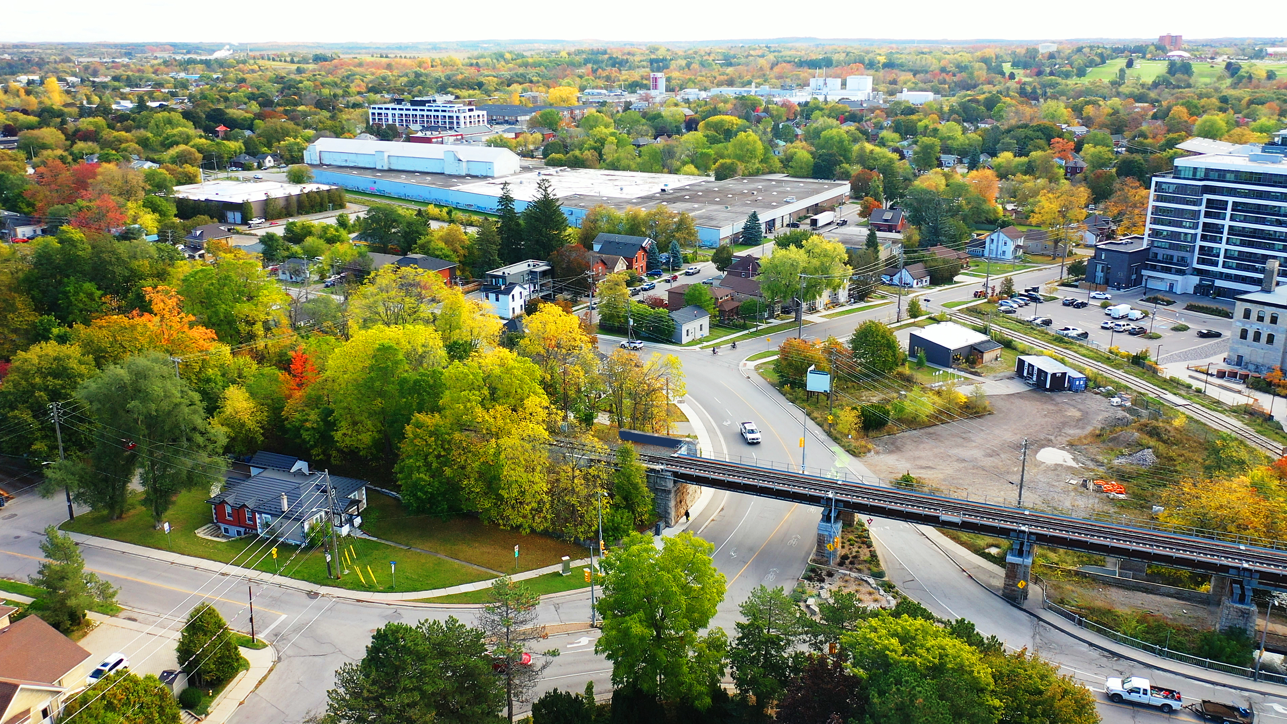 A cityscape with buildings, streets and urban forests.