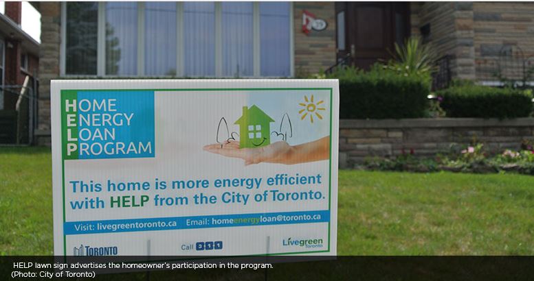Home Energy Loan Program program sign on lawn reading “This home is more energy efficient with HELP from the City of Toronto,” Toronto, ON