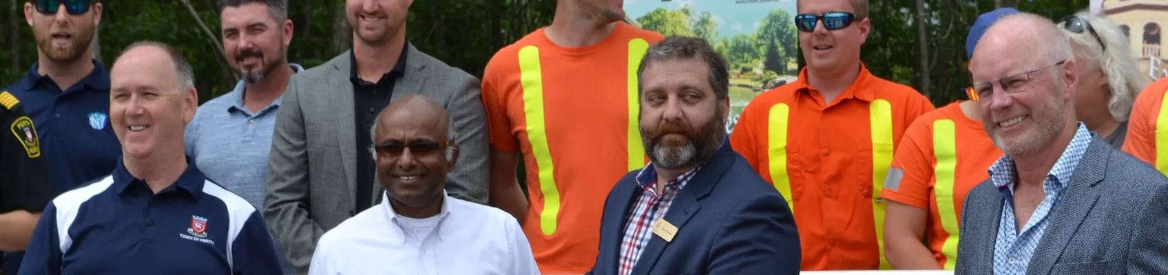 Representatives from the city of Perth cutting the ribbon at a ceremony opening the new wastewater treatment system