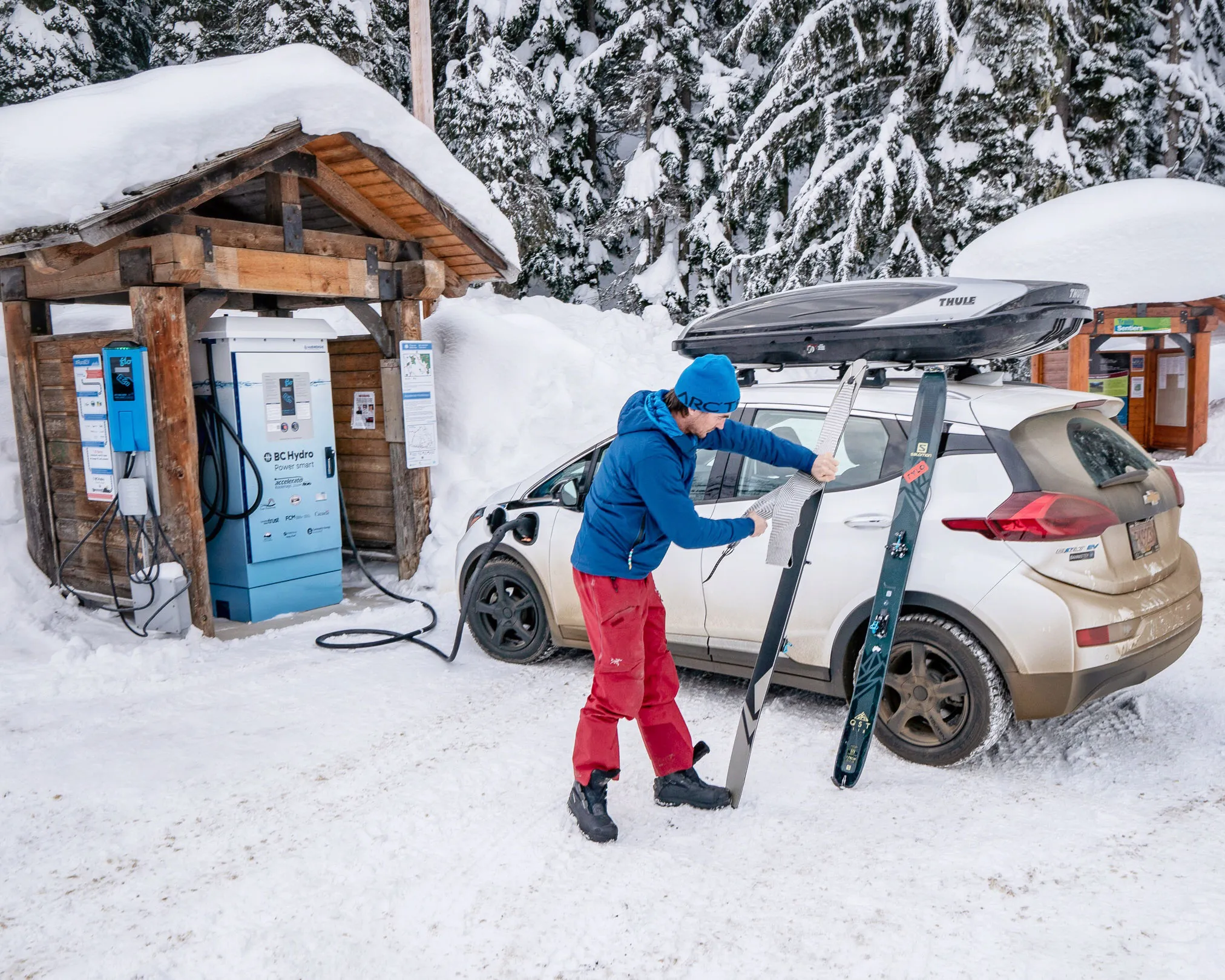 man outside of electric vehicle