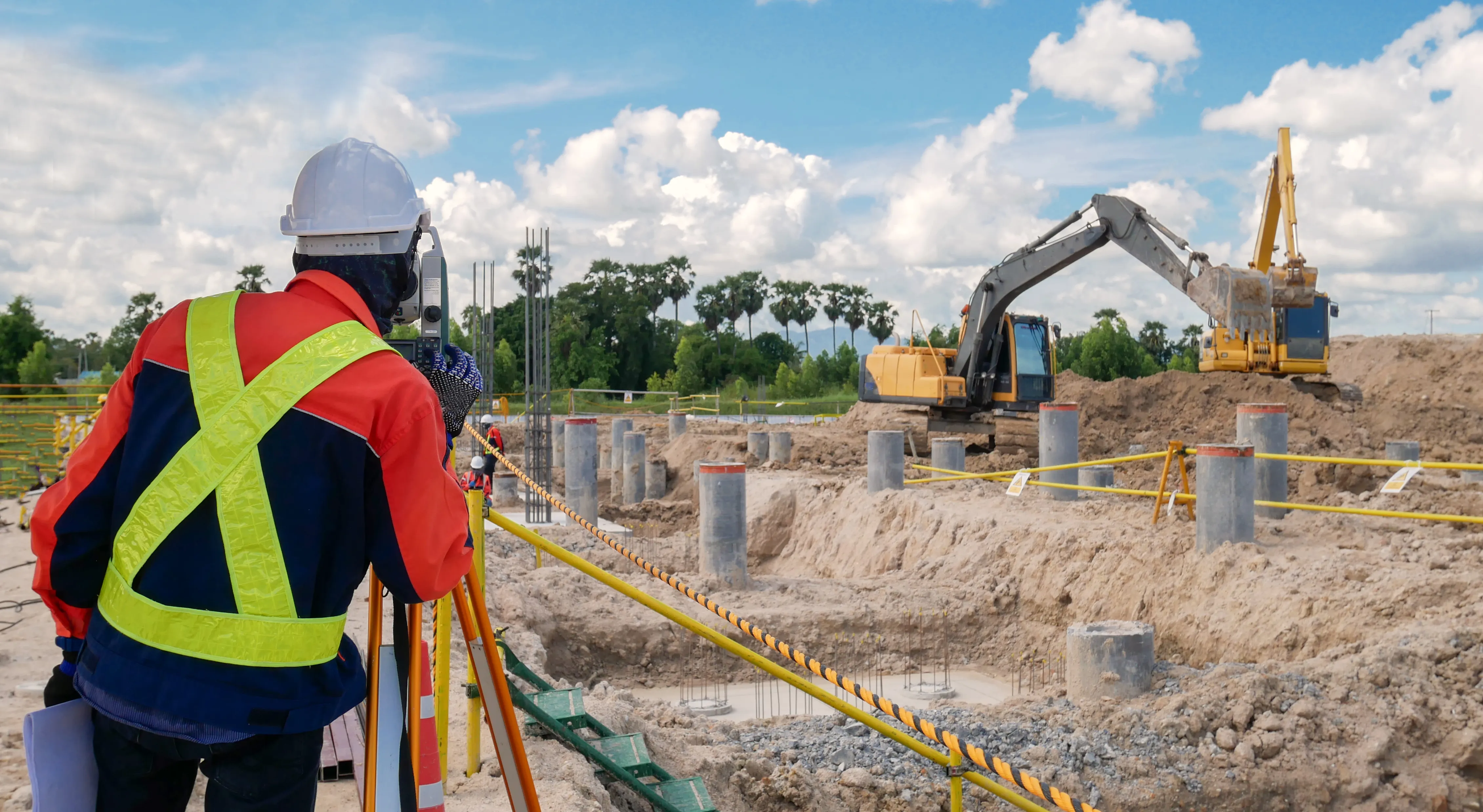 Surveyor surveying construction site