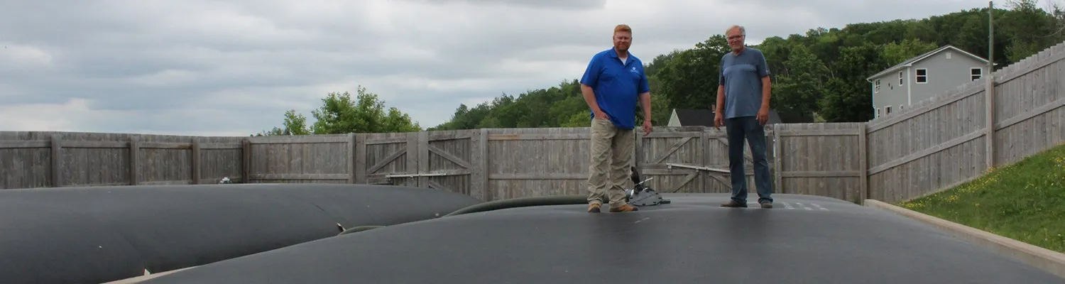 An engineer controlling the quality of water in sludge tank at a wastewater treatment plant.