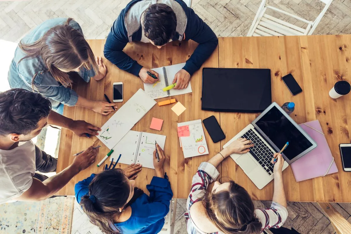Overhead view of business people around desk