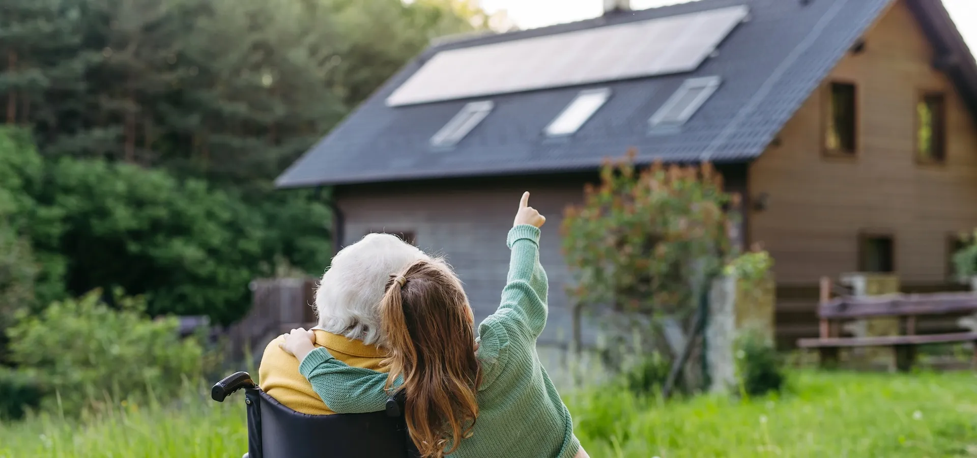 Granddaughter showing grandma solar panels on roof