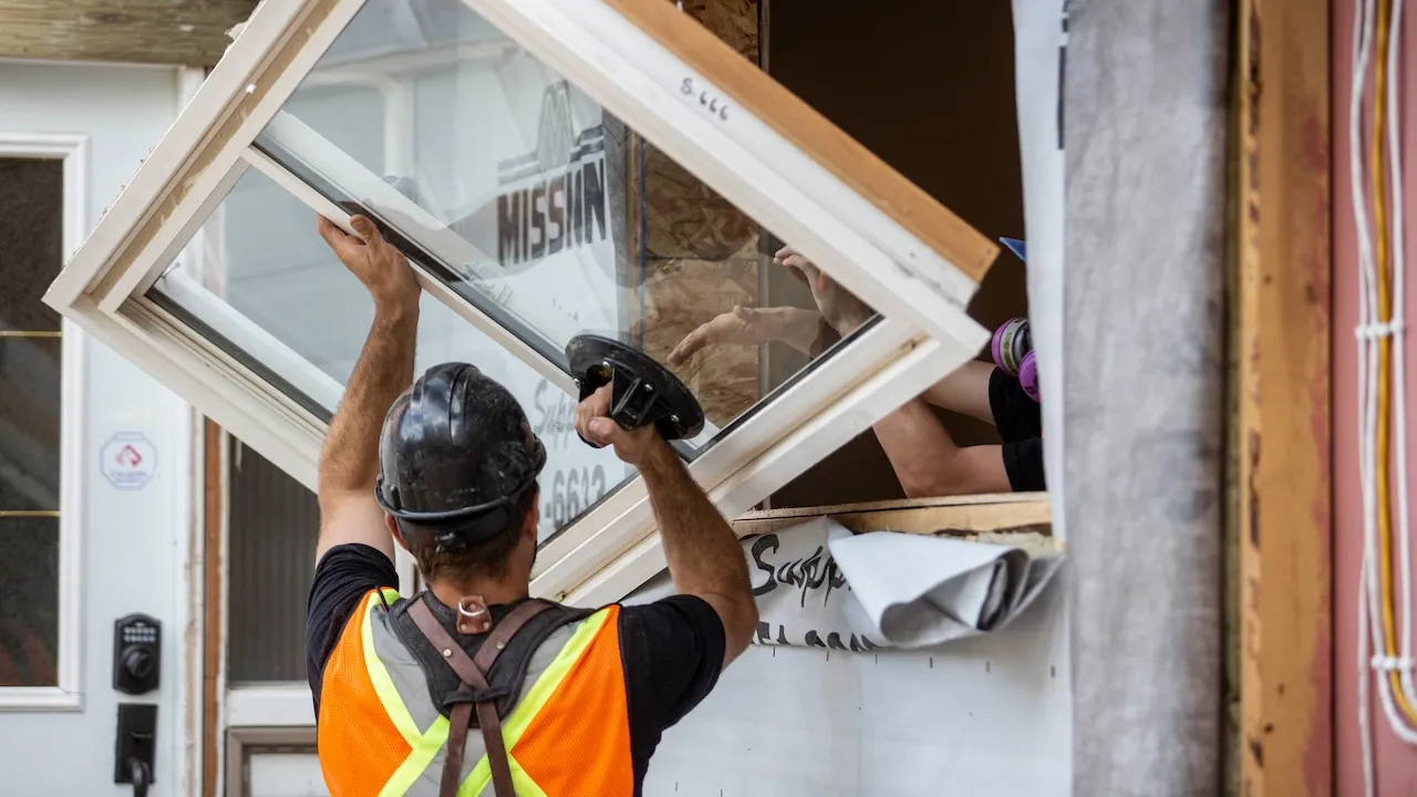man installing a window