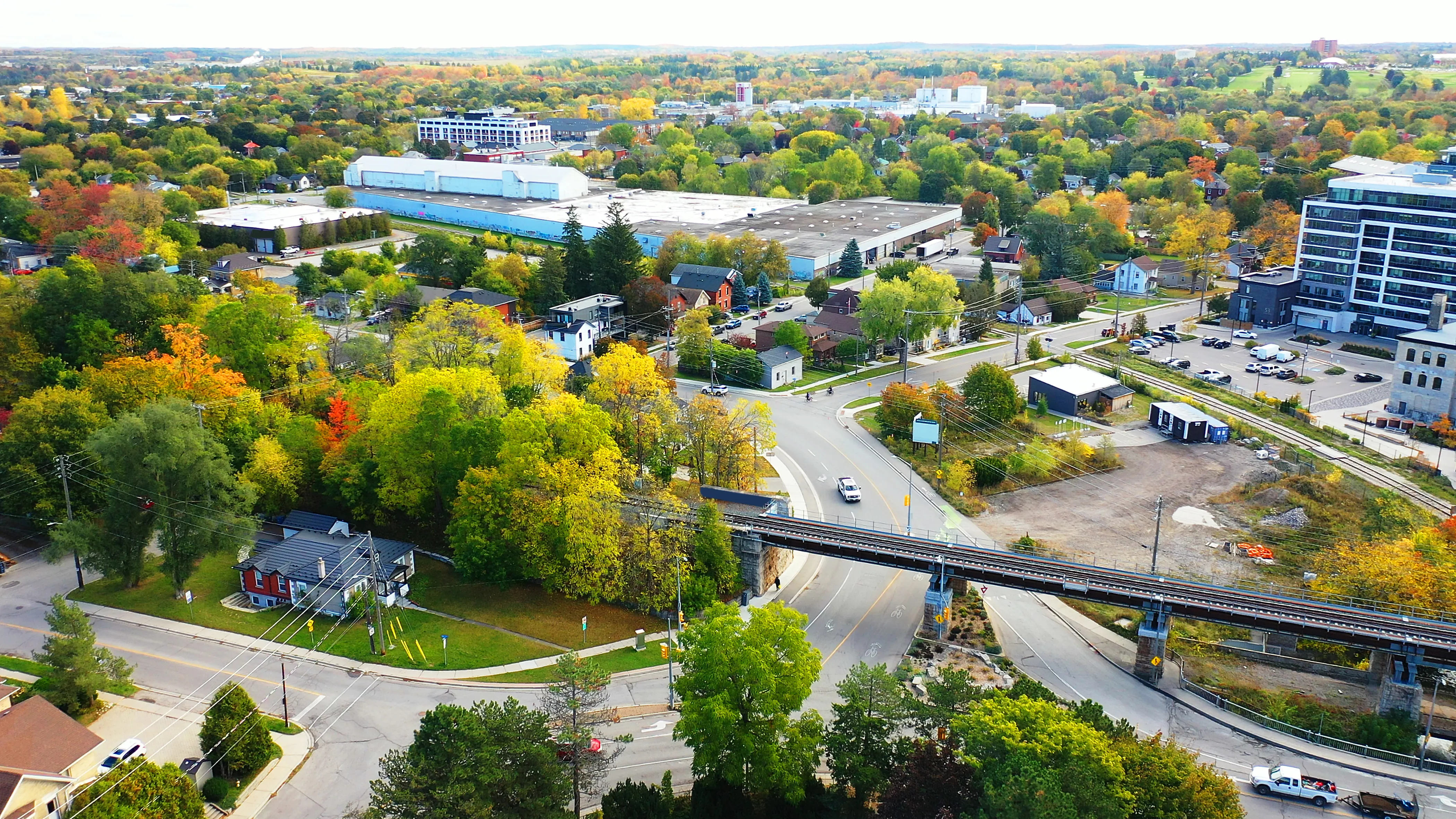 A cityscape with buildings, streets and urban forests.