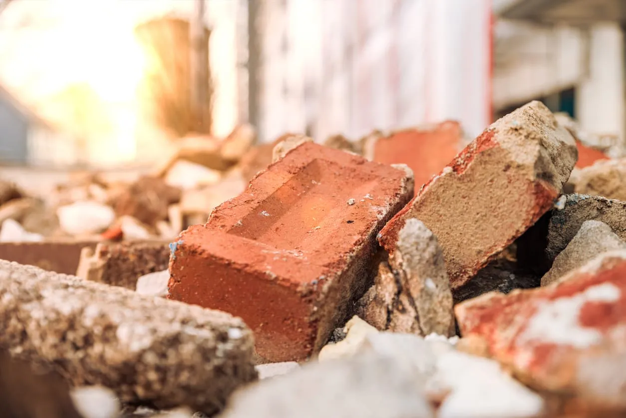 Bricks and reusable construction debris, representing circular construction materials. 