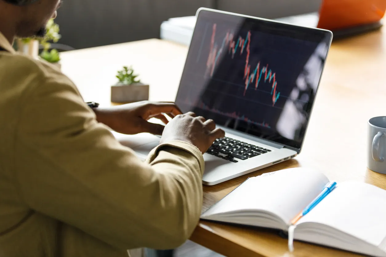 businessman typing on laptop. Research and making a data graph.